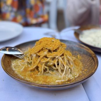 La Ciccia signature dishes Spaghittusu cun Allu Ollu e Bottarga (Spaghetti with garlic, oil, and cured fish roe)Prupisceddu in Umidu (Baby octopus stew)Pani Guttiau (Sardinian flatbread)
